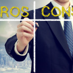 Business Man Writing Pros And Cons